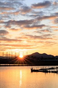 Scenic view of silhouette mountains against sky during sunset