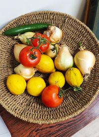 High angle view of fruits in basket on table