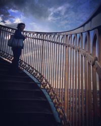 Low angle view of man on staircase