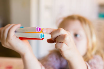 Close-up of girl playing with toy