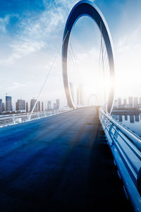 View of bridge and buildings against sky