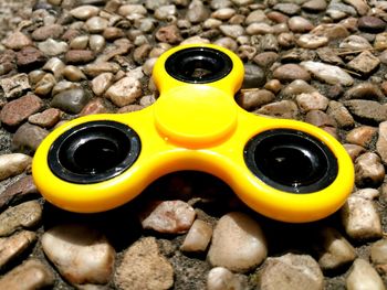 Close-up of yellow and sand on beach