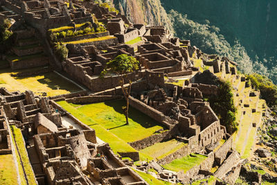 Machu picchu old inca ruins at sunrise in peru