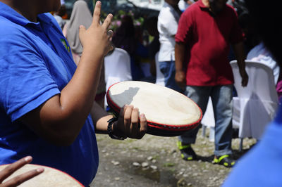 People playing on street in city