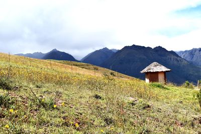 Scenic view of landscape and mountains against sky