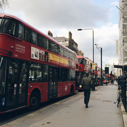 People in city against clear sky
