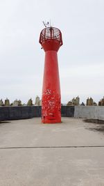 Lighthouse against cloudy sky