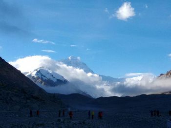 Scenic view of mountains against cloudy sky