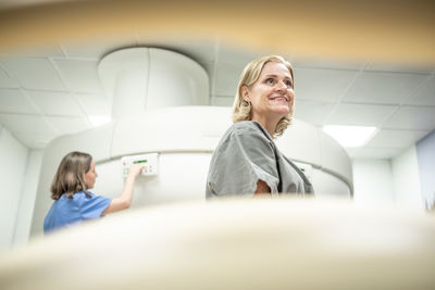  mature woman smiling at hospital