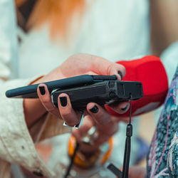 News reporters interviewing a group unrecognizable people outdoors