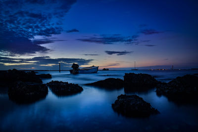 Scenic view of sea against sky at sunset