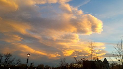 Low angle view of cloudy sky at sunset