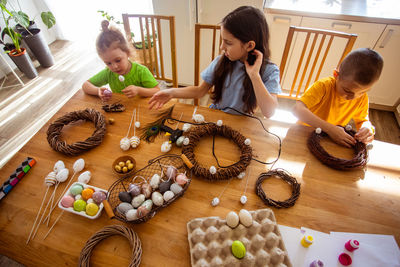 High angle view of people standing on table