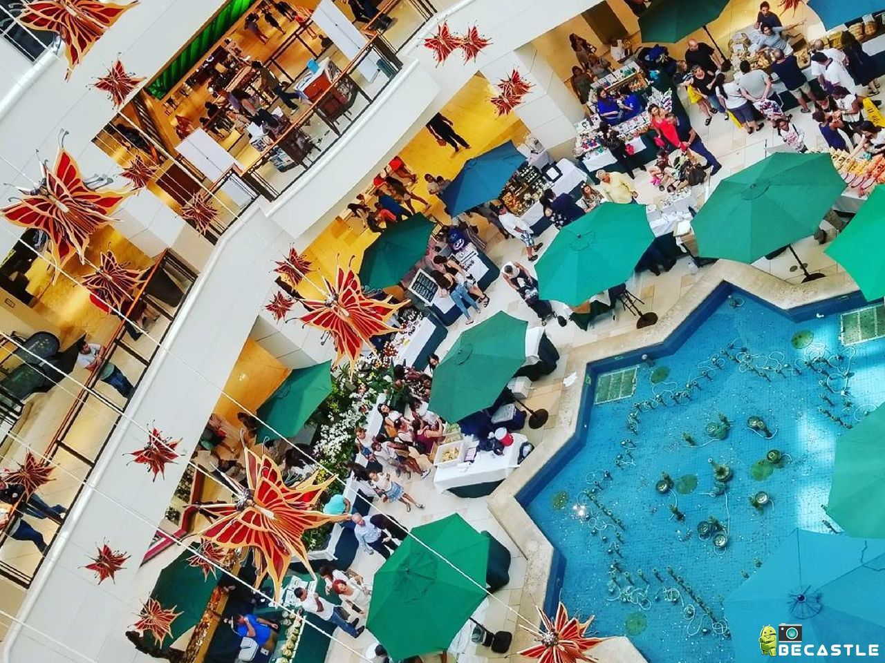 HIGH ANGLE VIEW OF CROWD AT SWIMMING POOL