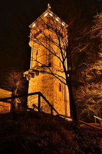 Low angle view of illuminated building at night