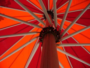 Low angle view of orange umbrella