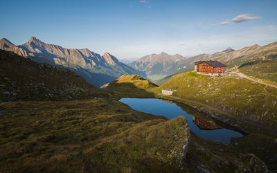 Scenic view of lake and mountains against sky