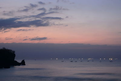 Scenic view of sea against sky at sunset