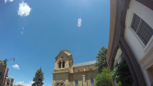 Low angle view of buildings against blue sky