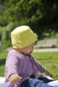 Close-up of baby sitting in park