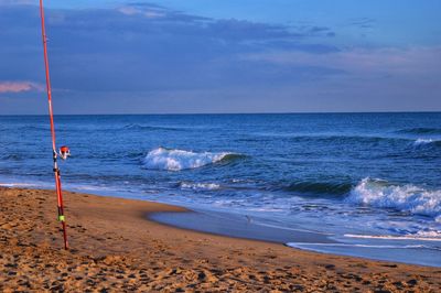 Scenic view of beach against sky