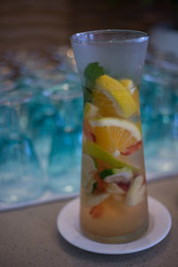 Close-up of fresh drink served on bar counter at restaurant