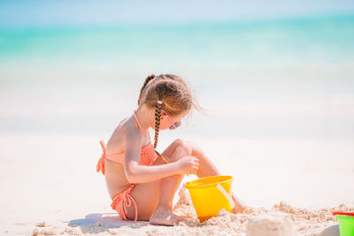 Girl sitting on beach