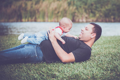 Vintage baby boy with red suspender in outdoor