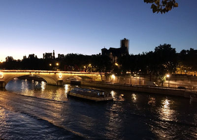 Bridge over river at night