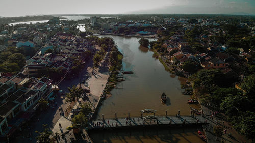 High angle view of river amidst buildings in town