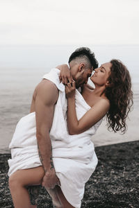 Young couple kissing in water