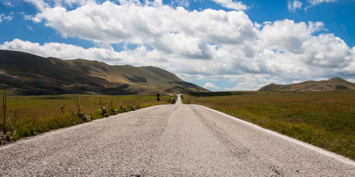 Road amidst landscape against sky