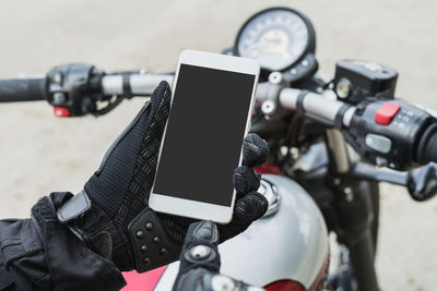 Close-up of man using mobile phone