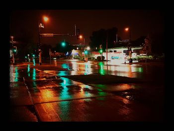 Illuminated street light at night