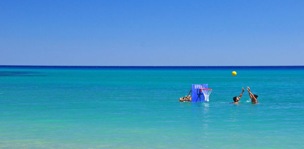 Scenic view of sea against blue sky