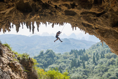 Man climbing at odin's den in yangshuo, a climbing mekka in china
