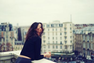 Woman looking at city view