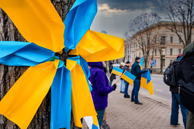 Protesters holding signs and flags participated at a - stand with ukraine.