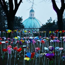 Multi colored umbrellas against sky