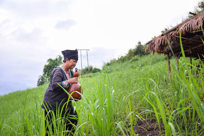 Man sitting on field