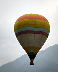 Low angle view of hot air balloons against sky