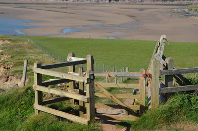 Wooden fence on field