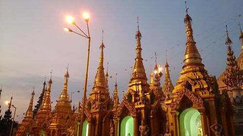 Low angle view of illuminated cathedral against sky