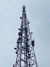 Low angle view of communications tower against sky