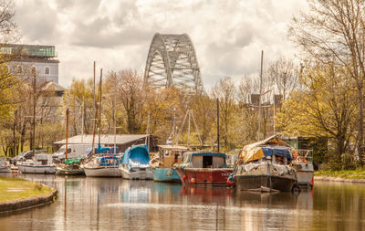 Boats moored in river