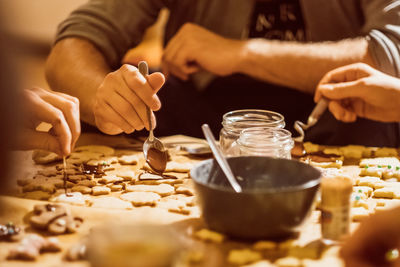 Midsection of man preparing food on table