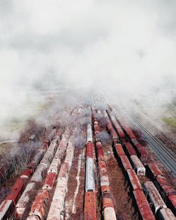 High angle view of smoke emitting from chimney against sky