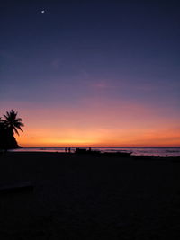 Scenic view of beach against sky during sunset