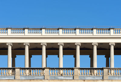 Low angle view of bridge against clear blue sky