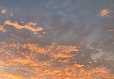 Low angle view of dramatic sky during sunset